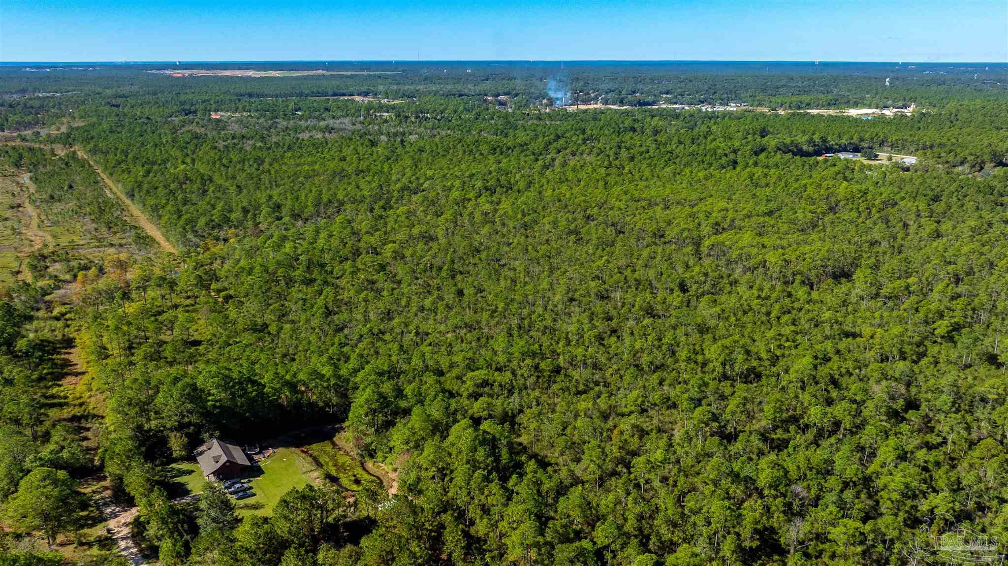 0 Sandy Point Street Milton, FL 32583 - Photo 2 of 6 a view of a lush green field