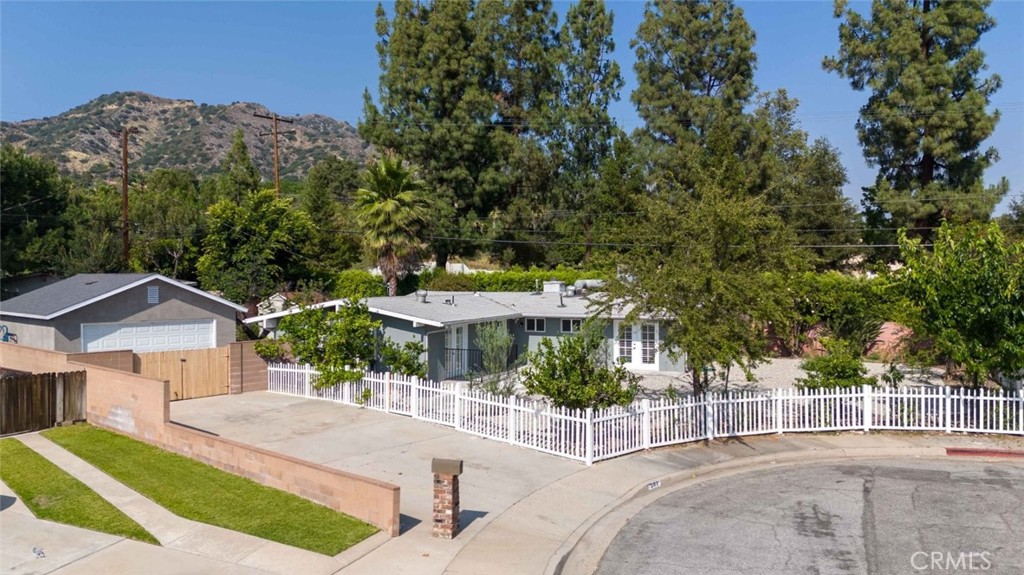 301 West Ashby Street Azusa, CA 91702 - Photo 3 of 75 a view of a patio with a table and chairs under an umbrella