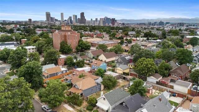 an aerial view of a city with lots of residential buildings