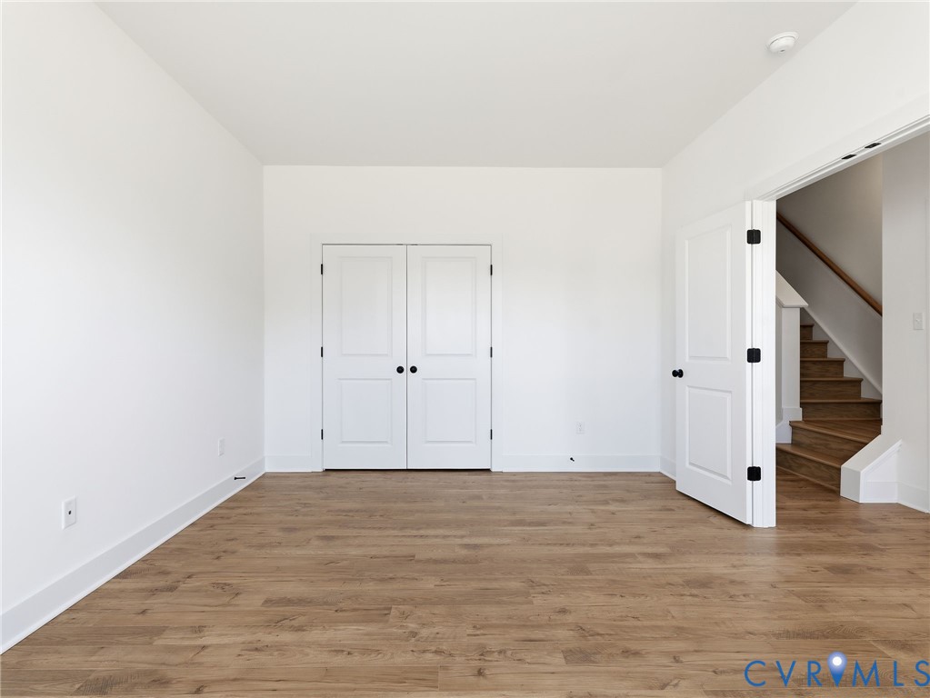 12026 Flowering Lavender Loop Henrico, VA 23233 - Photo 11 of 42 a view of room with wooden floor
