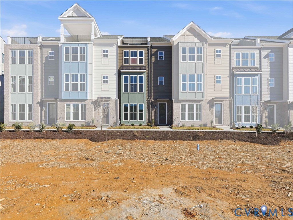 12026 Flowering Lavender Loop Henrico, VA 23233 - Photo 2 of 42 a swimming pool with outdoor view and trees