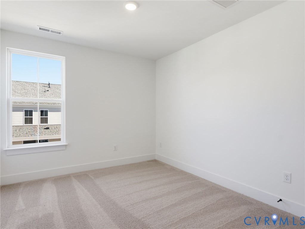 12026 Flowering Lavender Loop Henrico, VA 23233 - Photo 22 of 42 an empty room with a window