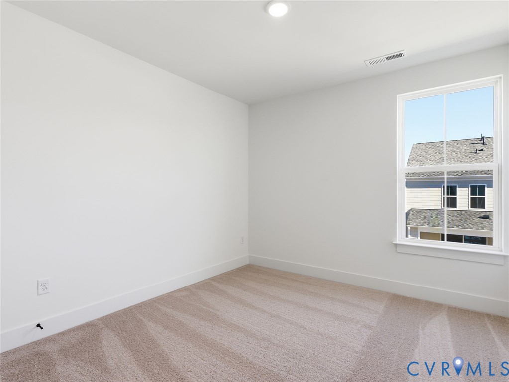 12026 Flowering Lavender Loop Henrico, VA 23233 - Photo 24 of 42 an empty room with a window