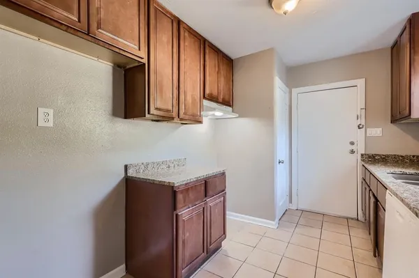 a kitchen with a stove and a microwave