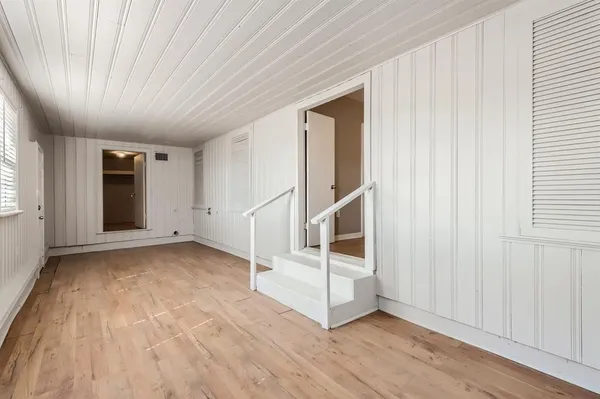 an empty room with windows