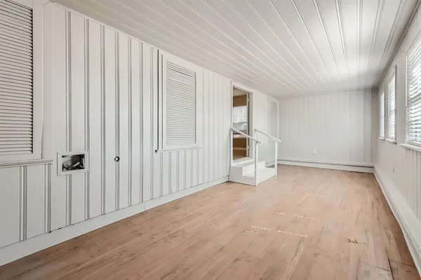 a view of empty room with windows