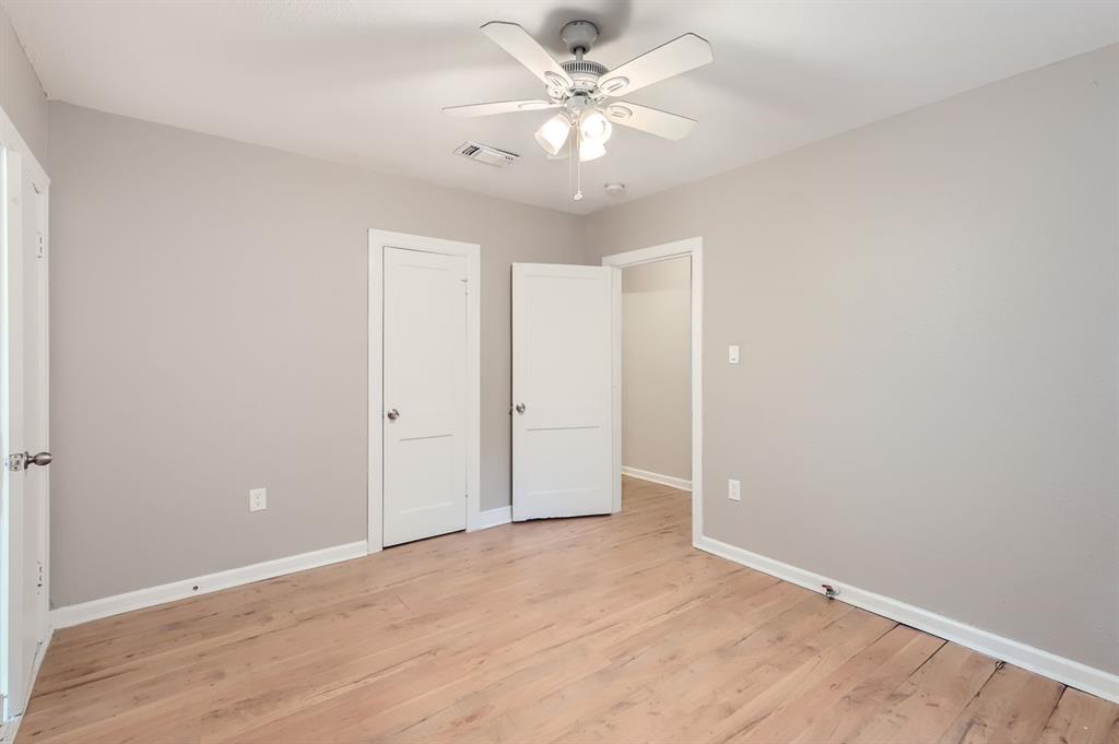 224 East Boyd Street Bonham, TX 75418 - Photo 21 of 28 an empty room with fan and a ceiling fan