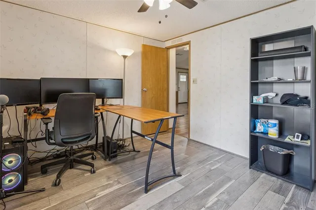 a workspace with furniture and wooden floor