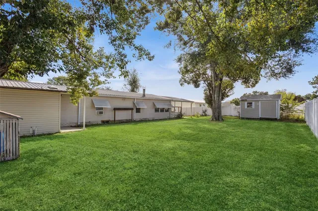 front view of a house with a garden