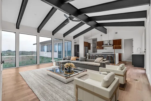 a living room with furniture and a large window