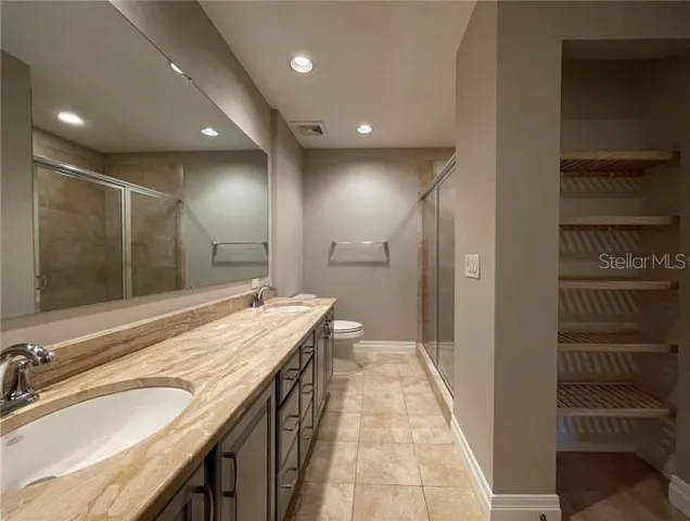 a view of a room with wooden floor and window