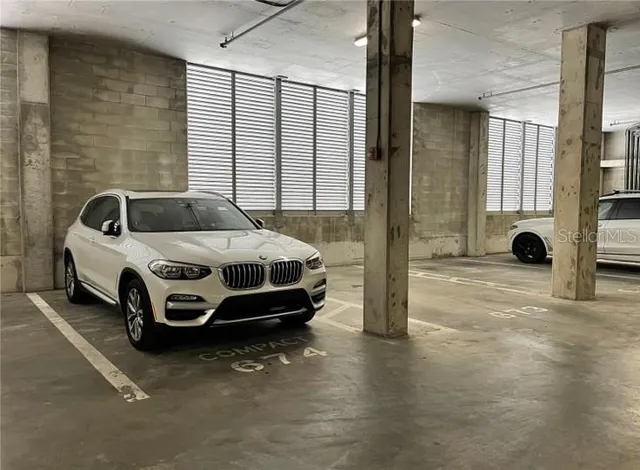 a view of a fountain is middle in the backyard