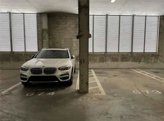 a front view of a multi story building with community park