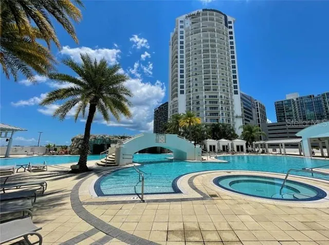 a view of a swimming pool with seating area