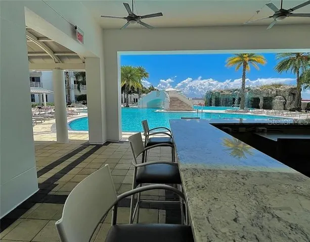 a living room with wooden floor and furniture