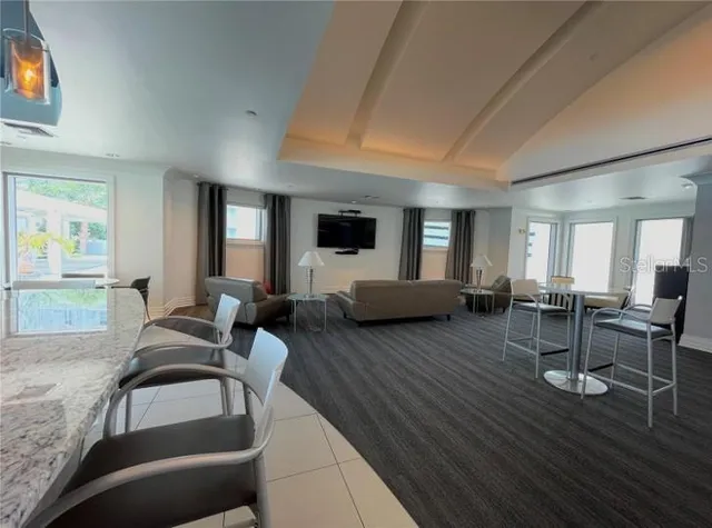 a view of patio with a table and chairs under an umbrella