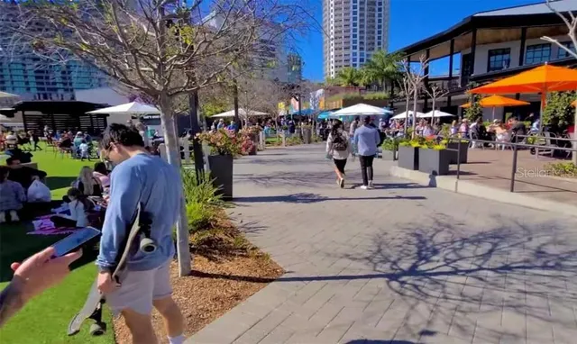 a front view of a building with lots of trees