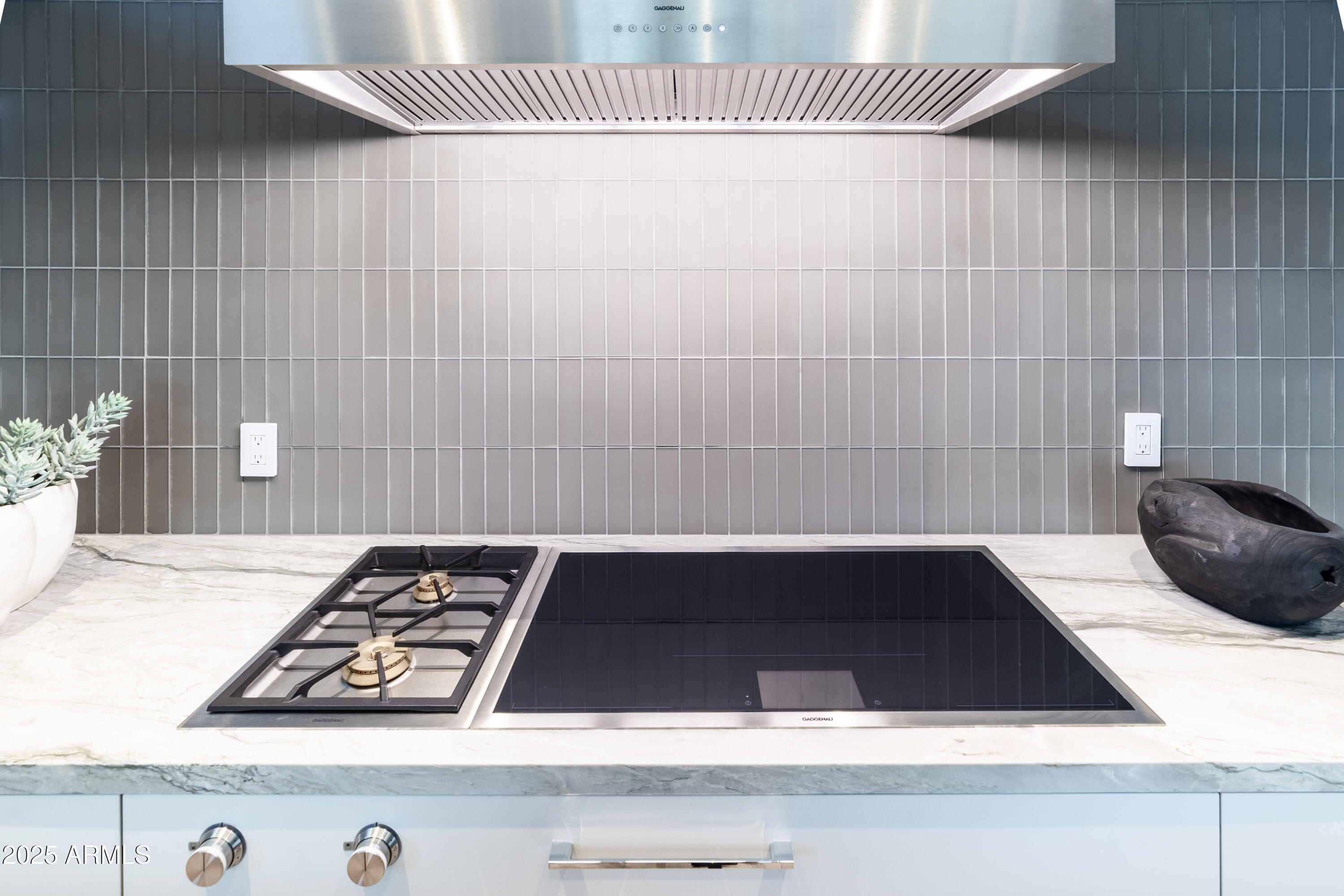 6850 East Joshua Tree Lane Paradise Valley, AZ 85253 - Photo 16 of 39 a close view of sink a stove and a microwave oven