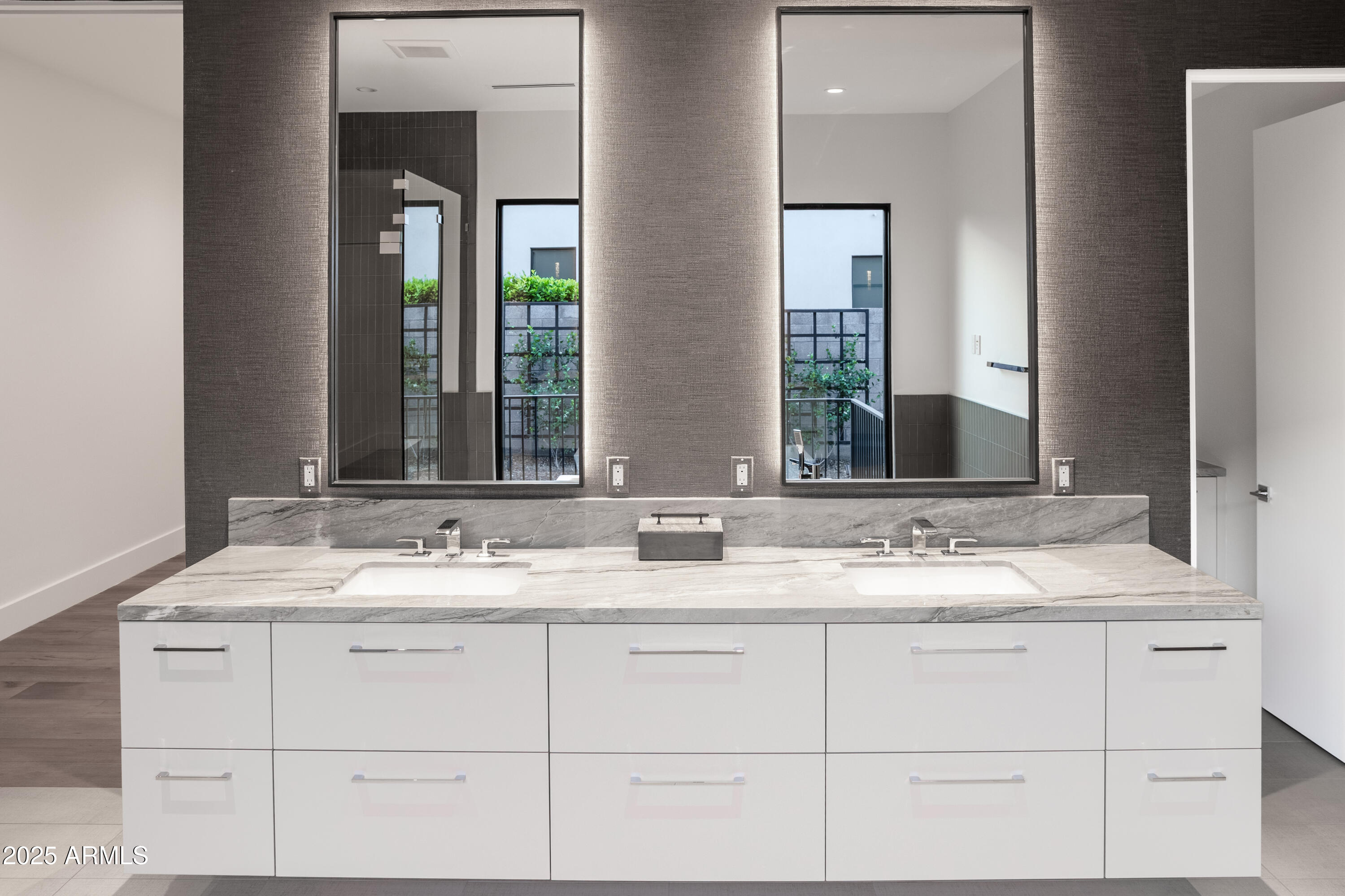 6850 East Joshua Tree Lane Paradise Valley, AZ 85253 - Photo 22 of 39 a bathroom with a sink and a mirror