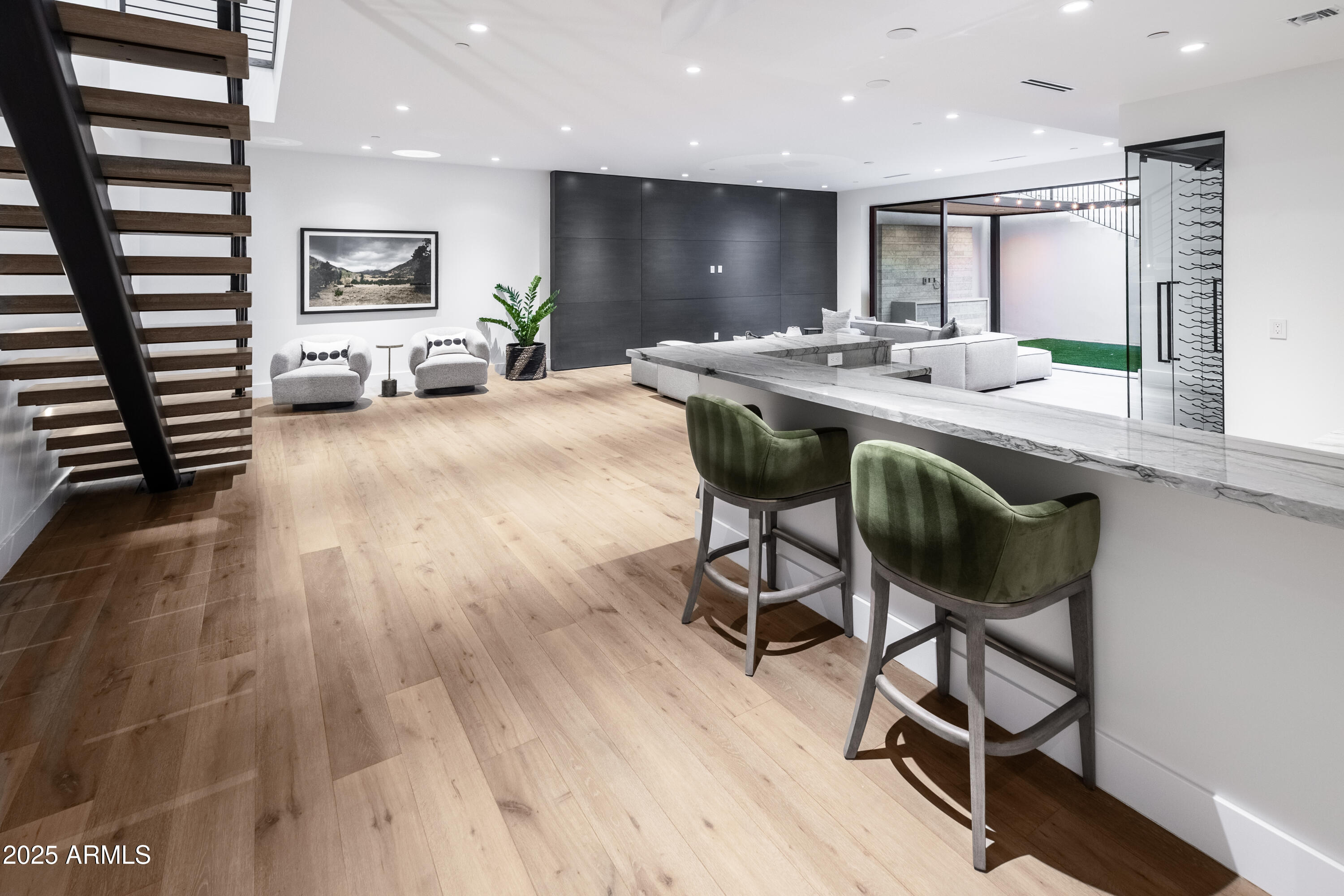 6850 East Joshua Tree Lane Paradise Valley, AZ 85253 - Photo 29 of 39 a kitchen with a table chairs refrigerator and microwave
