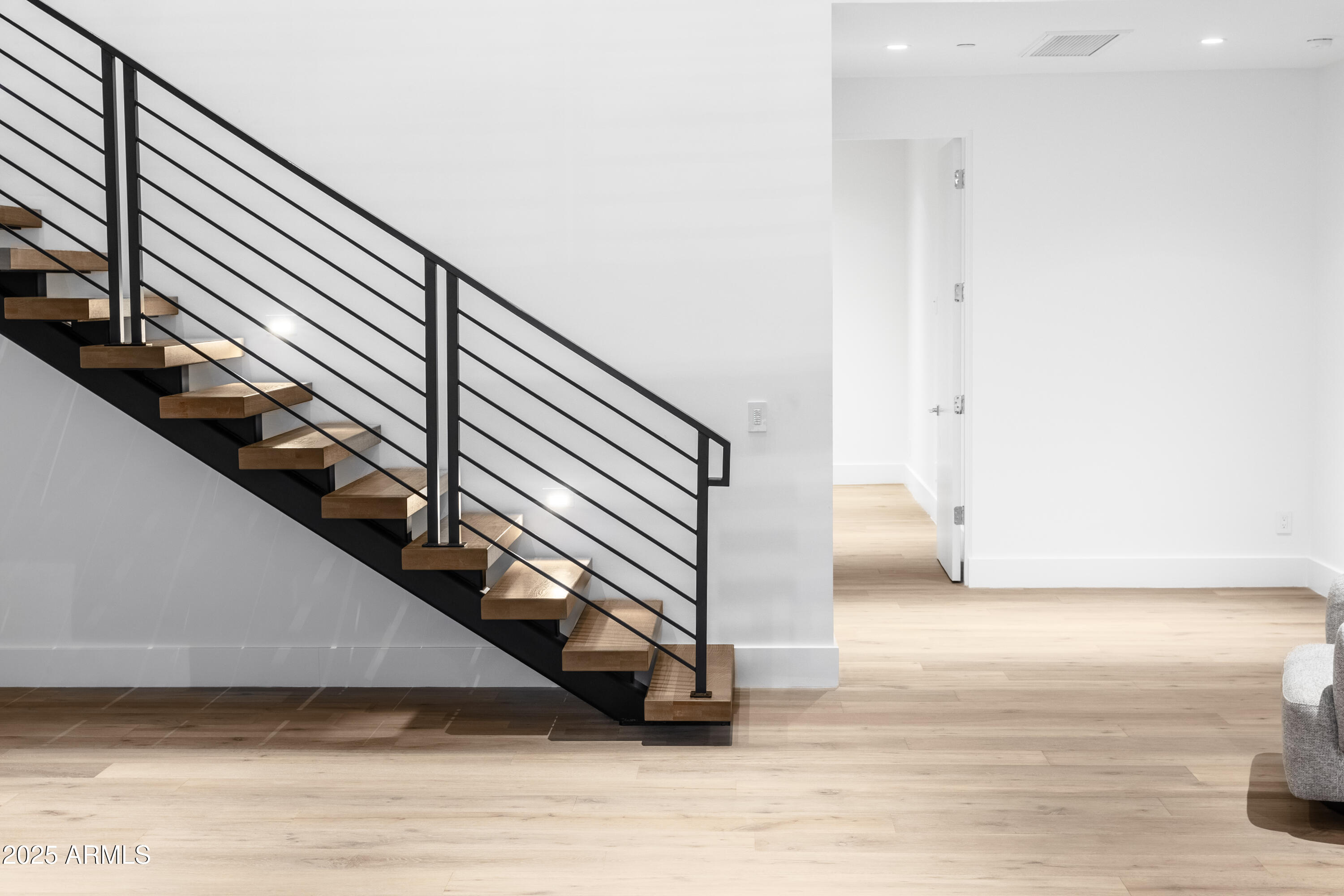 6850 East Joshua Tree Lane Paradise Valley, AZ 85253 - Photo 35 of 39 a view of entryway and hall with wooden floor