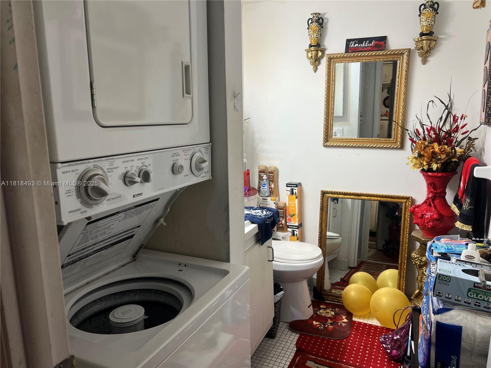 4160 Inverrary Drive, Unit 306 Lauderhill, FL 33319 - Photo 11 of 20 a utility room with dryer and washer