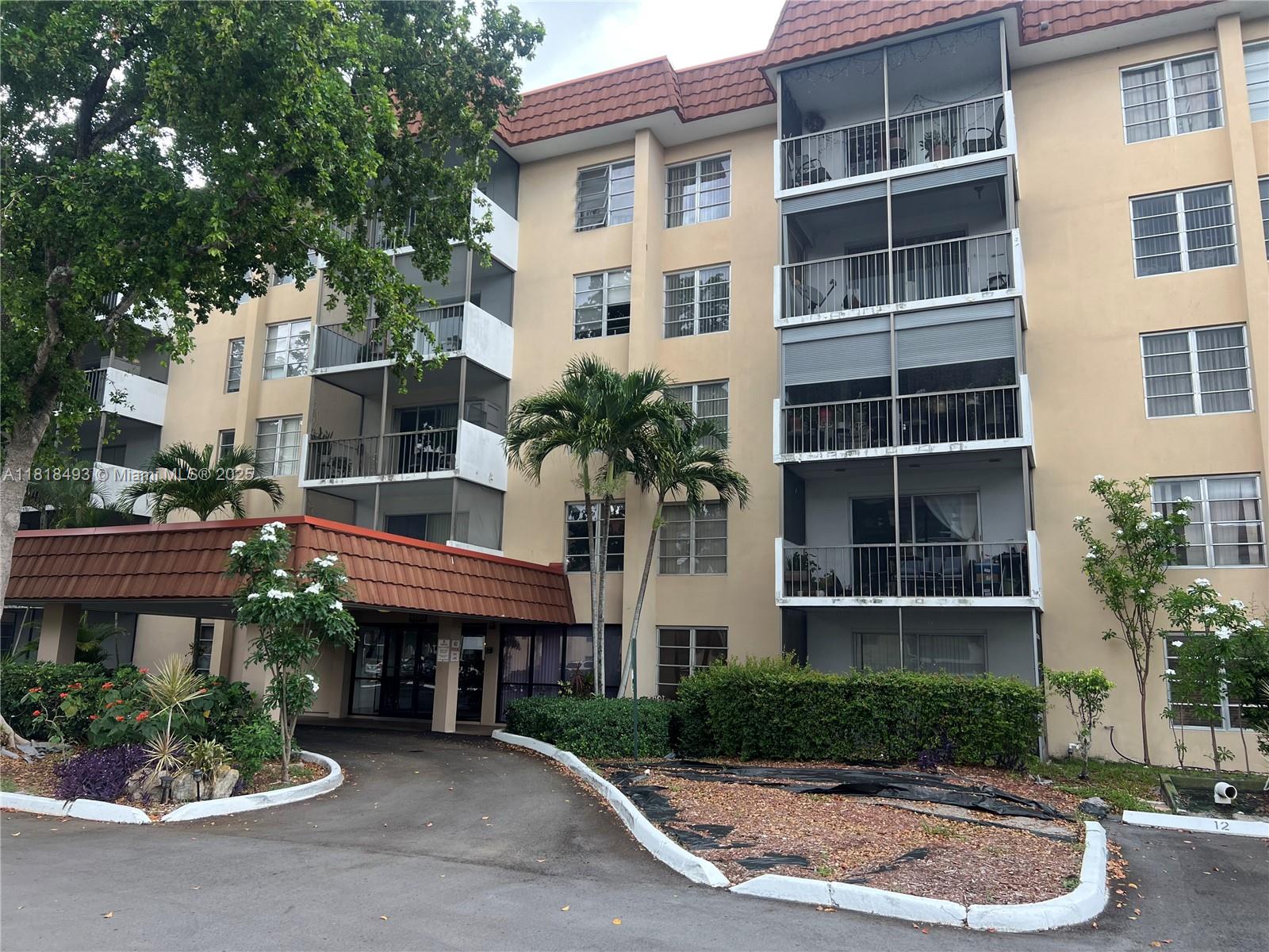 4160 Inverrary Drive, Unit 306 Lauderhill, FL 33319 - Photo 19 of 20 a house view with a garden space