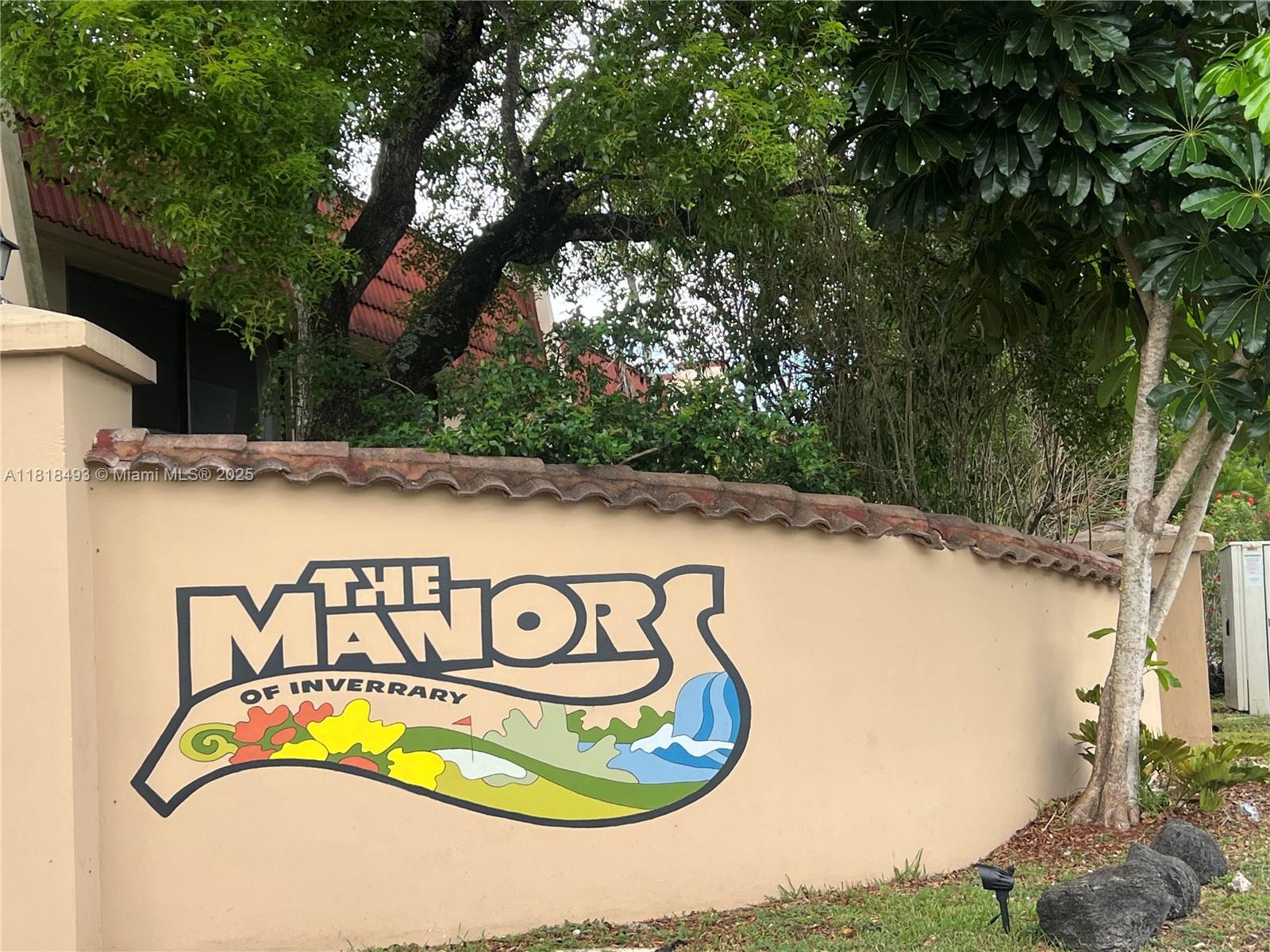 4160 Inverrary Drive, Unit 306 Lauderhill, FL 33319 - Photo 20 of 20 a street sign that is on a wall