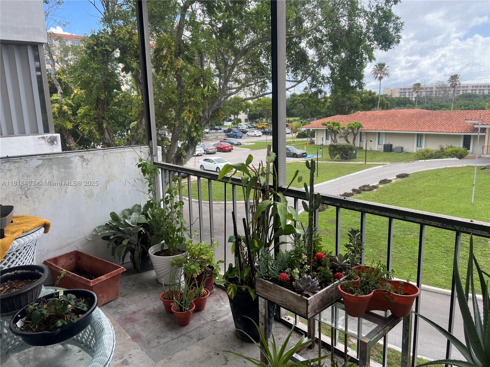 4160 Inverrary Drive, Unit 306 Lauderhill, FL 33319 - Photo 8 of 20 a view of a balcony with chairs and plants