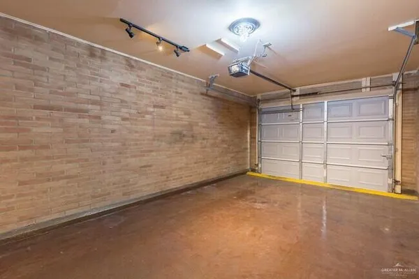 a living room with furniture and a ceiling fan