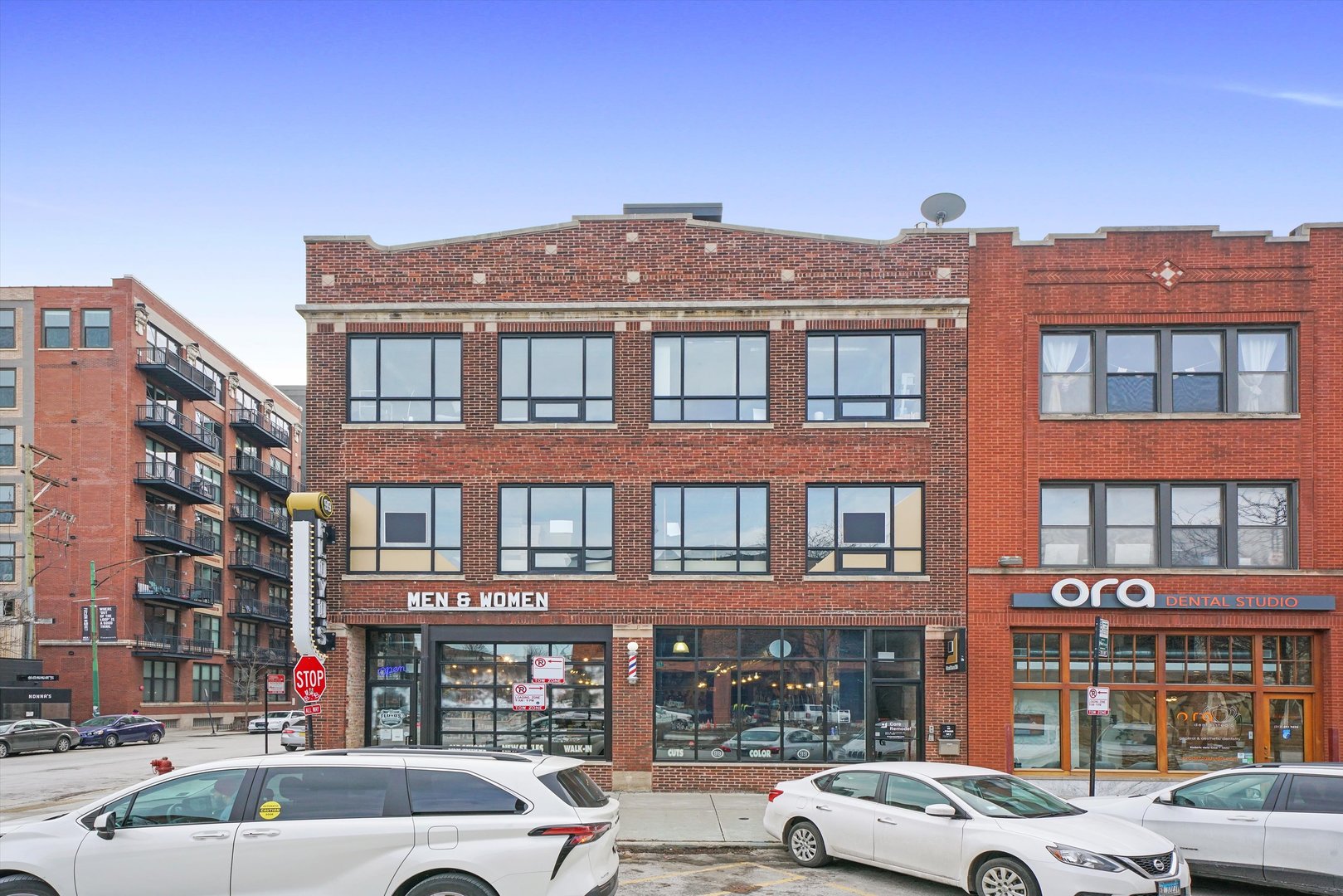 935 West Randolph Street, Unit PH Chicago, IL 60607 - Photo 1 of 35 a front view of a building with lot of cars and trees