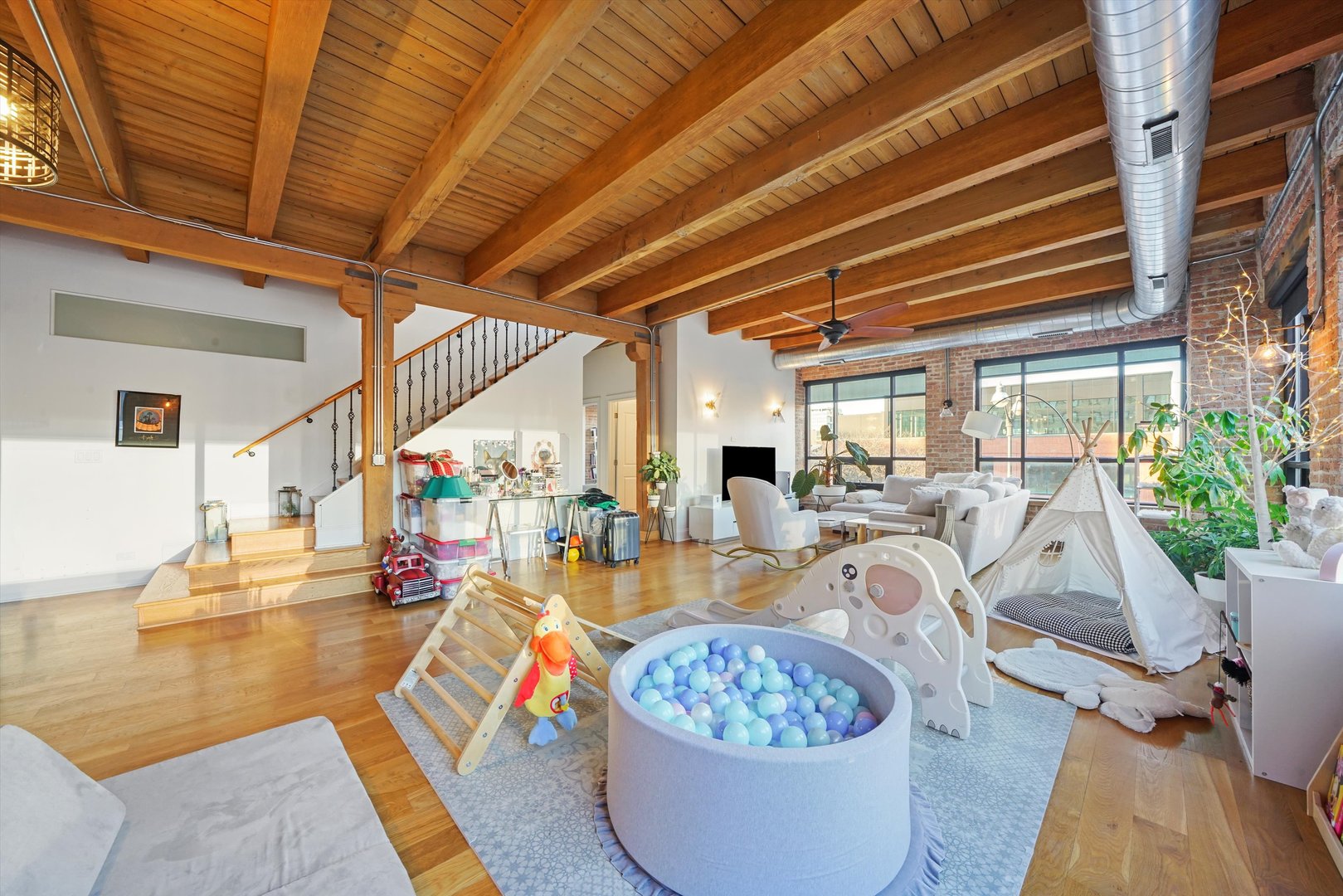 935 West Randolph Street, Unit PH Chicago, IL 60607 - Photo 13 of 35 a living room with furniture a rug and white walls