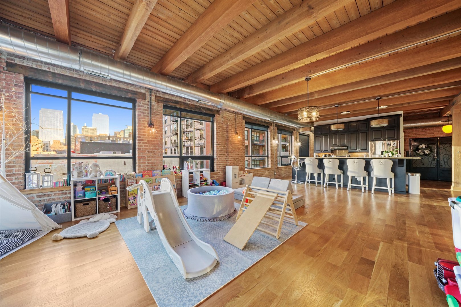 935 West Randolph Street, Unit PH Chicago, IL 60607 - Photo 16 of 35 a living room with lots of furniture wooden floor and outdoor seating