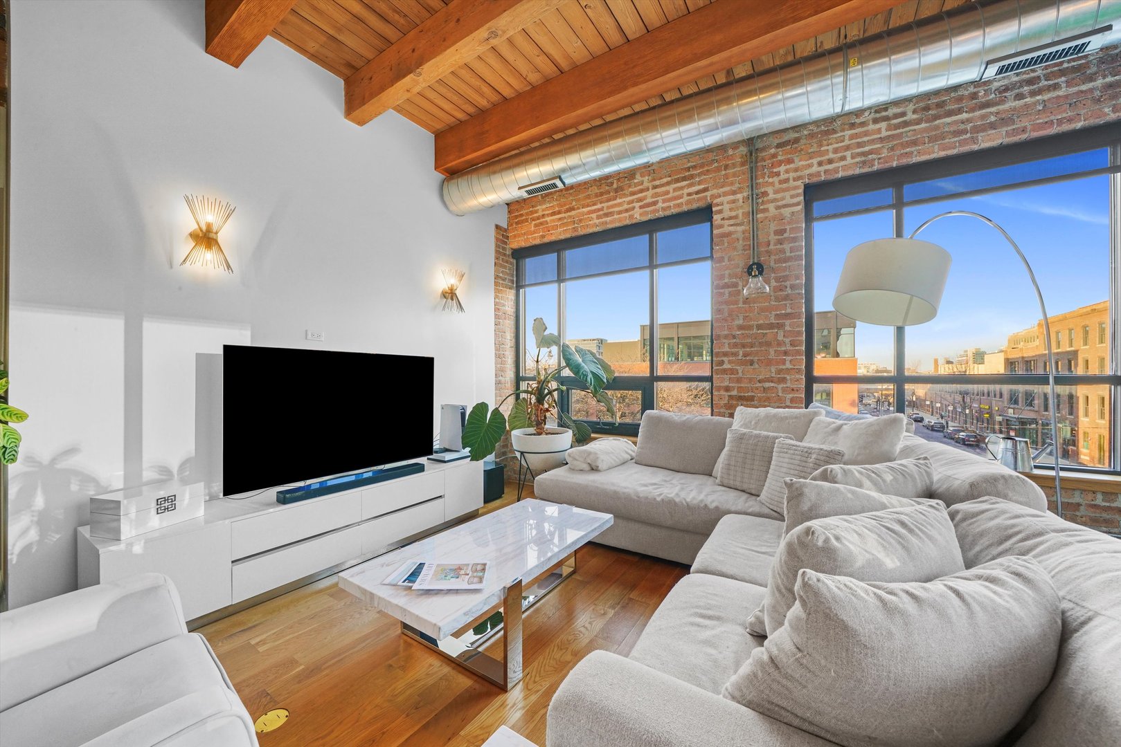 935 West Randolph Street, Unit PH Chicago, IL 60607 - Photo 17 of 35 a living room with furniture and a flat screen tv