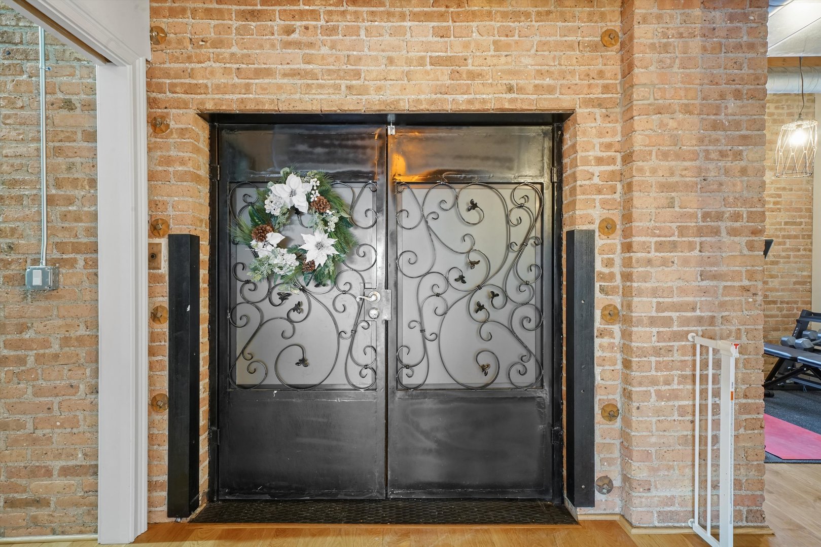 935 West Randolph Street, Unit PH Chicago, IL 60607 - Photo 2 of 35 a door with brick wall and door