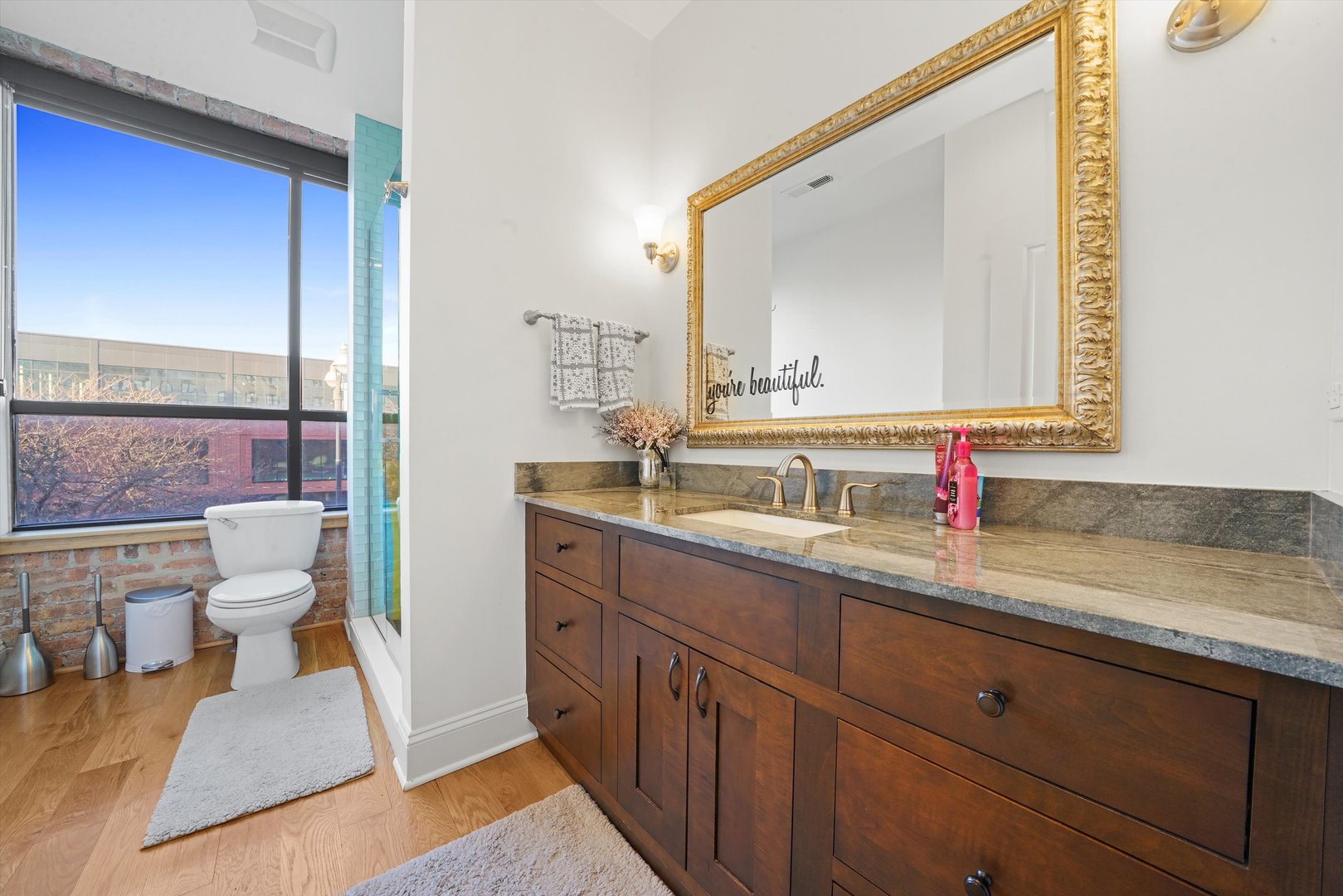 935 West Randolph Street, Unit PH Chicago, IL 60607 - Photo 21 of 35 a bathroom with a sink and a mirror