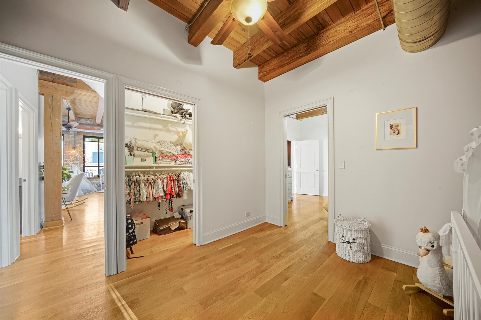 935 West Randolph Street, Unit PH Chicago, IL 60607 - Photo 24 of 35 a bedroom with a bed and wooden floor