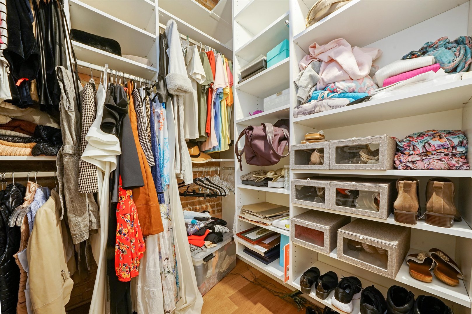 935 West Randolph Street, Unit PH Chicago, IL 60607 - Photo 25 of 35 a view of walk in closet with clothes and shoes