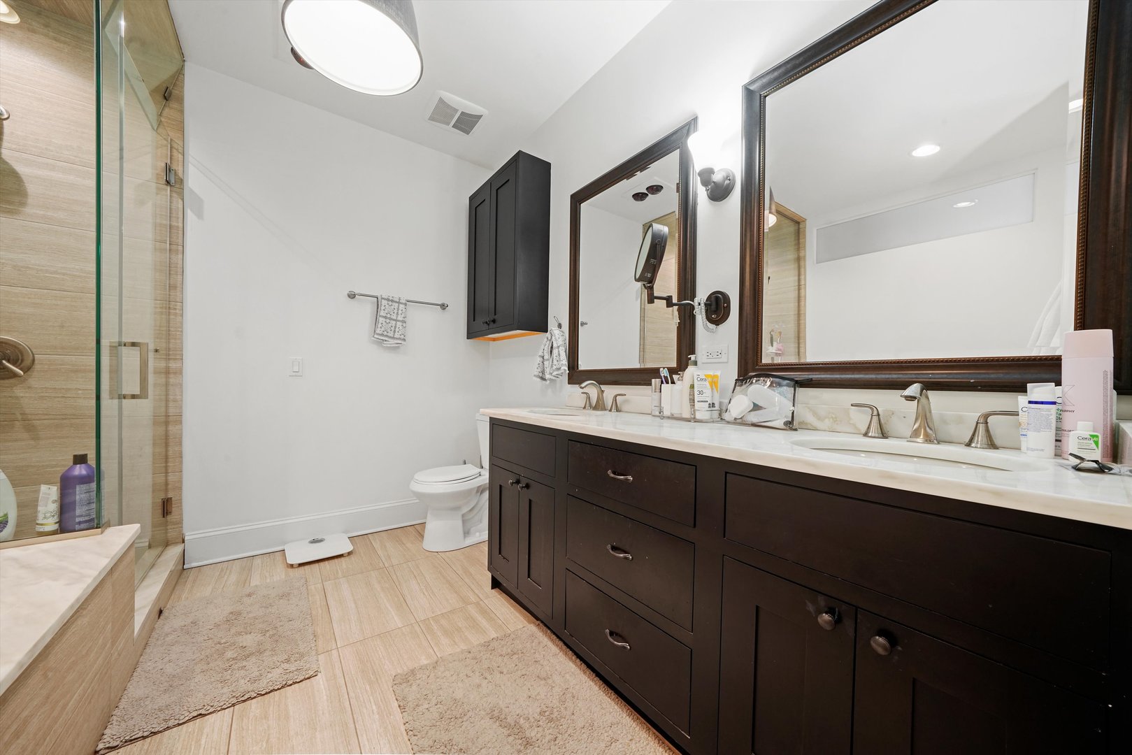 935 West Randolph Street, Unit PH Chicago, IL 60607 - Photo 26 of 35 a spacious bathroom with a double vanity sink toilet and a mirror