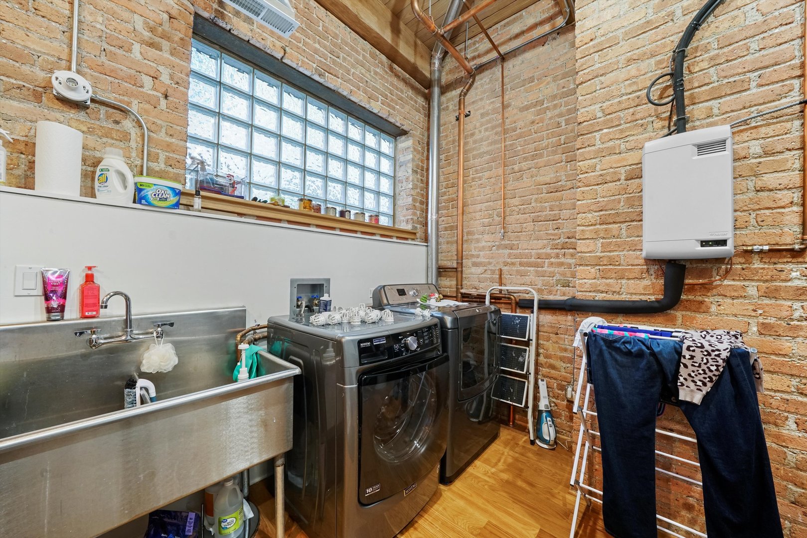935 West Randolph Street, Unit PH Chicago, IL 60607 - Photo 29 of 35 a kitchen with stainless steel appliances granite countertop a sink and cabinets