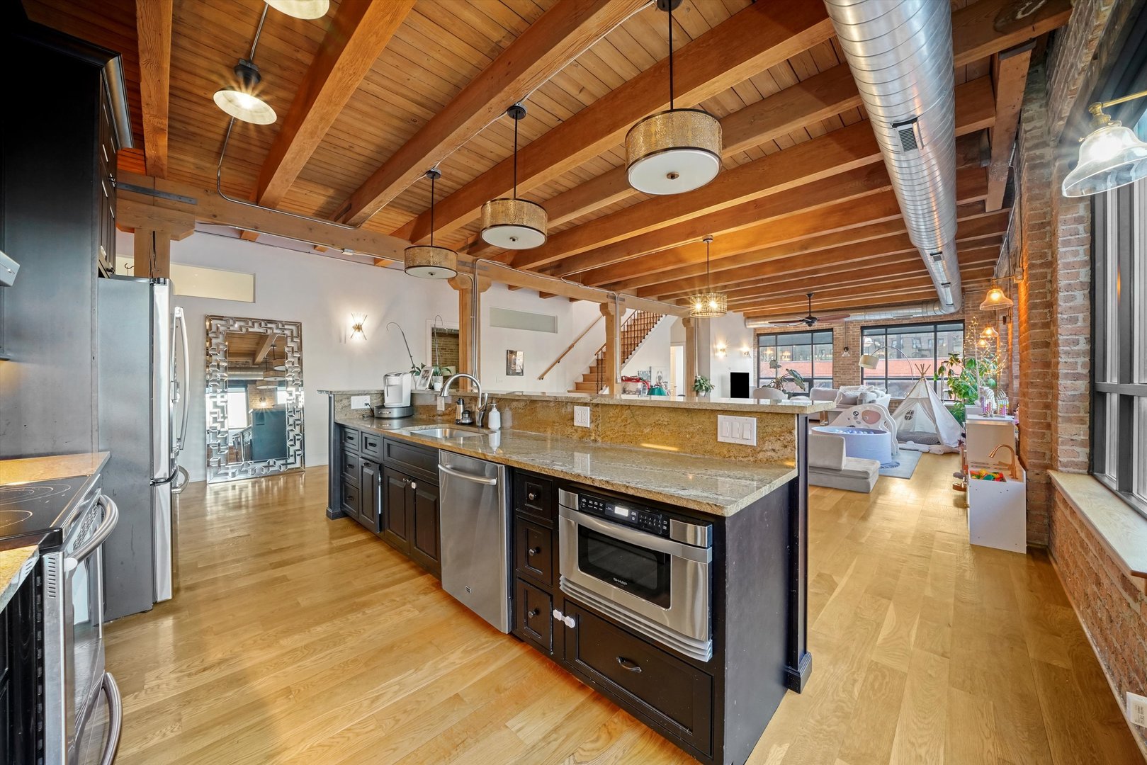 935 West Randolph Street, Unit PH Chicago, IL 60607 - Photo 9 of 35 a kitchen with a stove and a sink