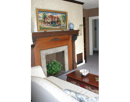 83 Ridgewood Terrace Springfield, MA 01105 - Photo 6 of 8 a living room with furniture and a fireplace