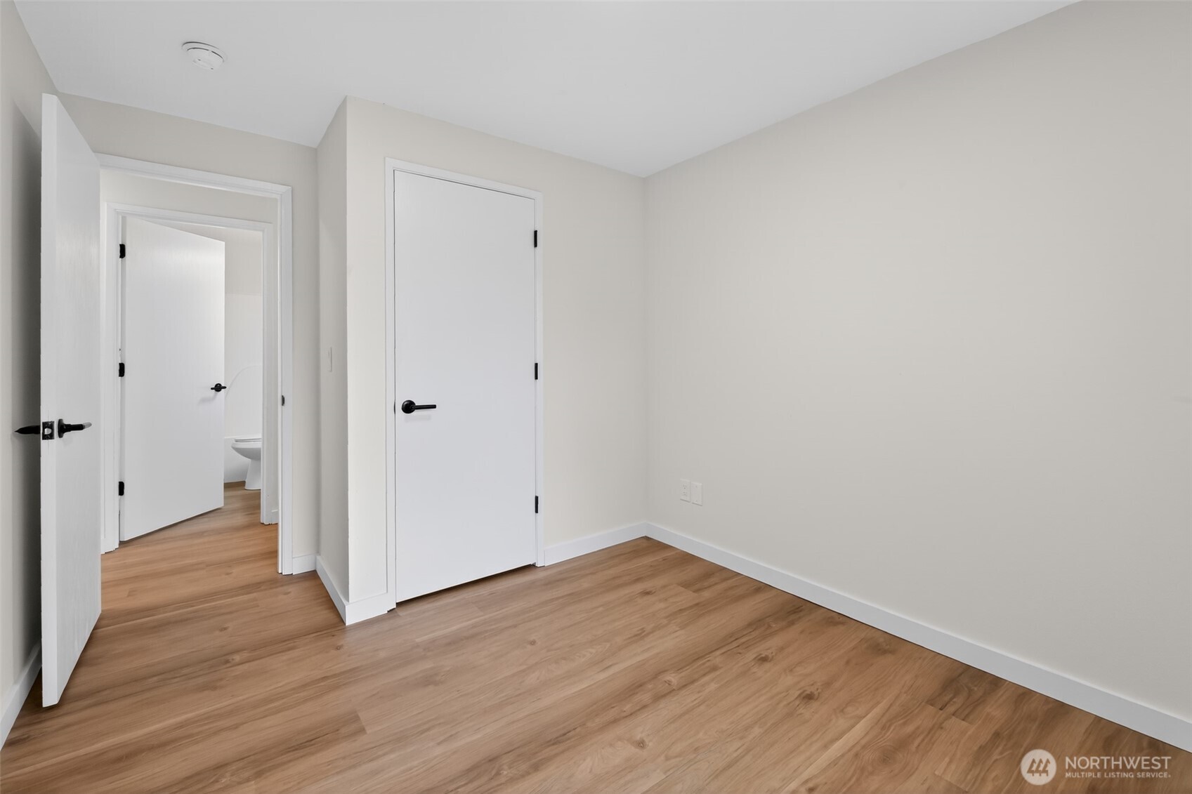 320 213th Place Southwest Bothell, WA 98021 - Photo 23 of 29 a view of an empty room with wooden floor