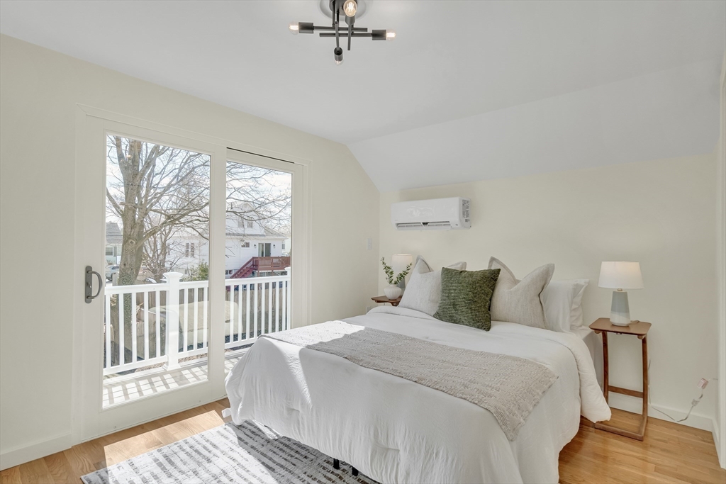56 Riverview Street Dedham, MA 02026 - Photo 11 of 29 a bedroom with a bed and a window