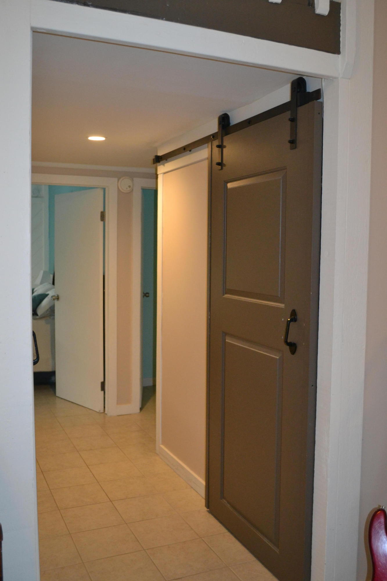 216 Coral Road Islamorada, FL 33036 - Photo 15 of 34 bathroom/laundry barn door