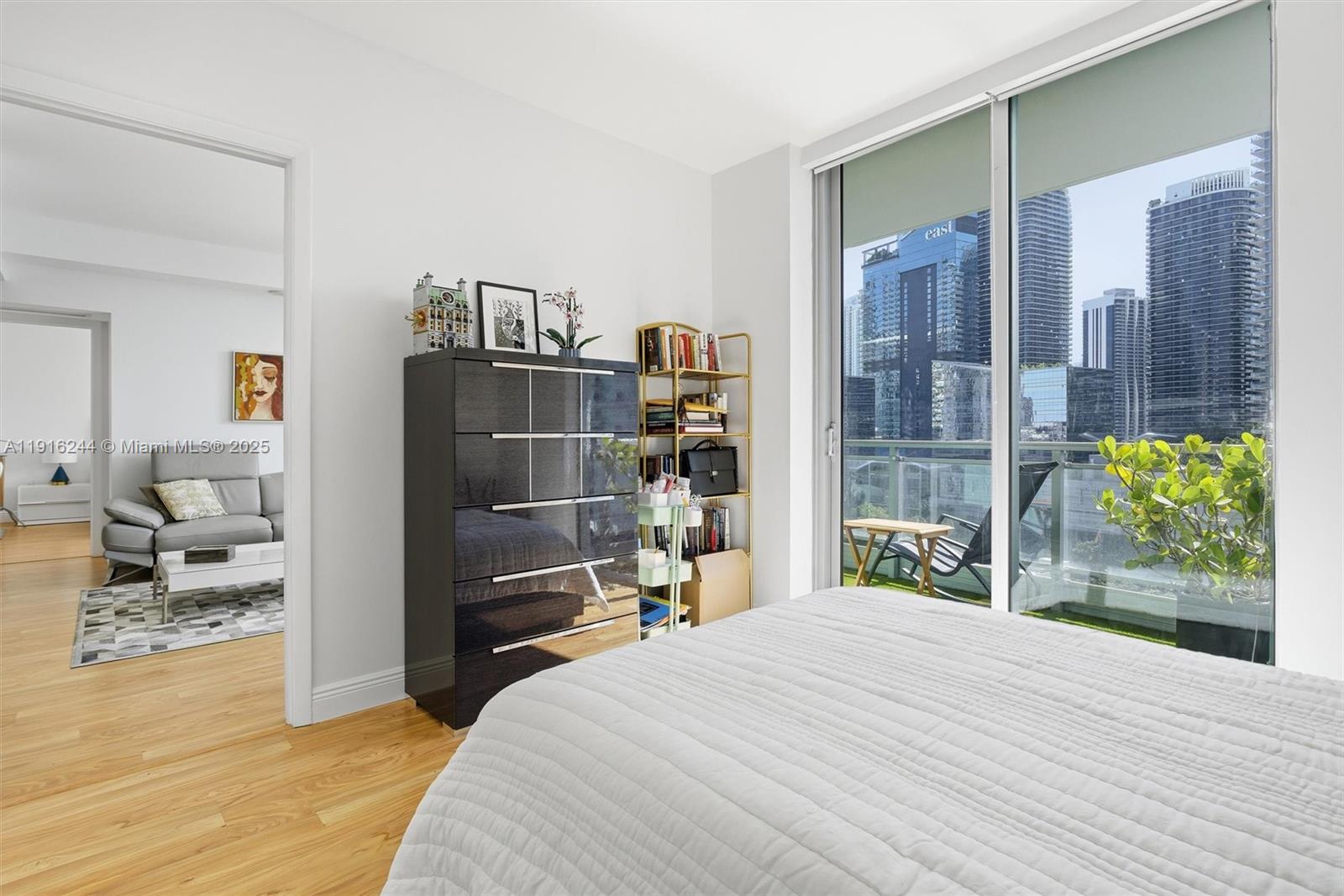 92 Southwest 3rd Street, Unit 1604 Miami, FL 33130 - Photo 25 of 53 a bedroom with a bed and a window