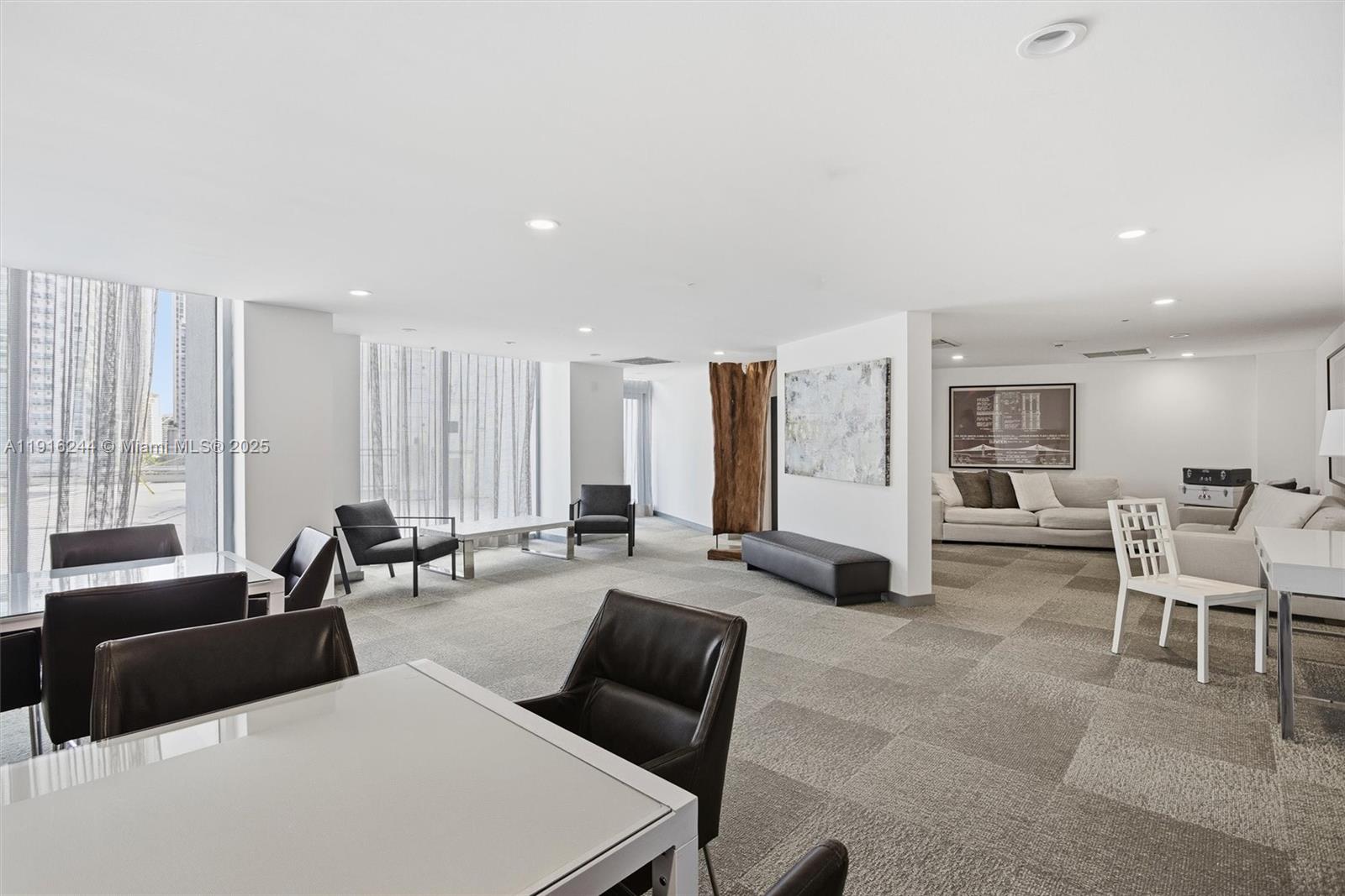 92 Southwest 3rd Street, Unit 1604 Miami, FL 33130 - Photo 27 of 53 a living room with furniture and large windows