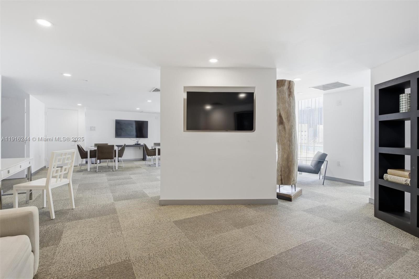 92 Southwest 3rd Street, Unit 1604 Miami, FL 33130 - Photo 28 of 53 a living room with furniture and a flat screen tv