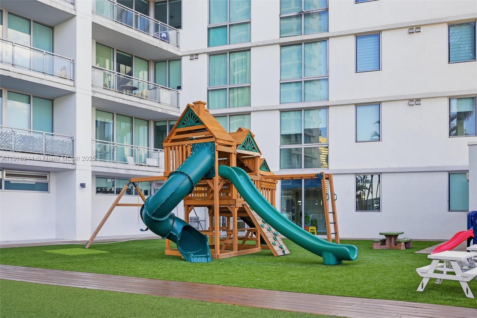 92 Southwest 3rd Street, Unit 1604 Miami, FL 33130 - Photo 31 of 53 a front view of a house with a yard