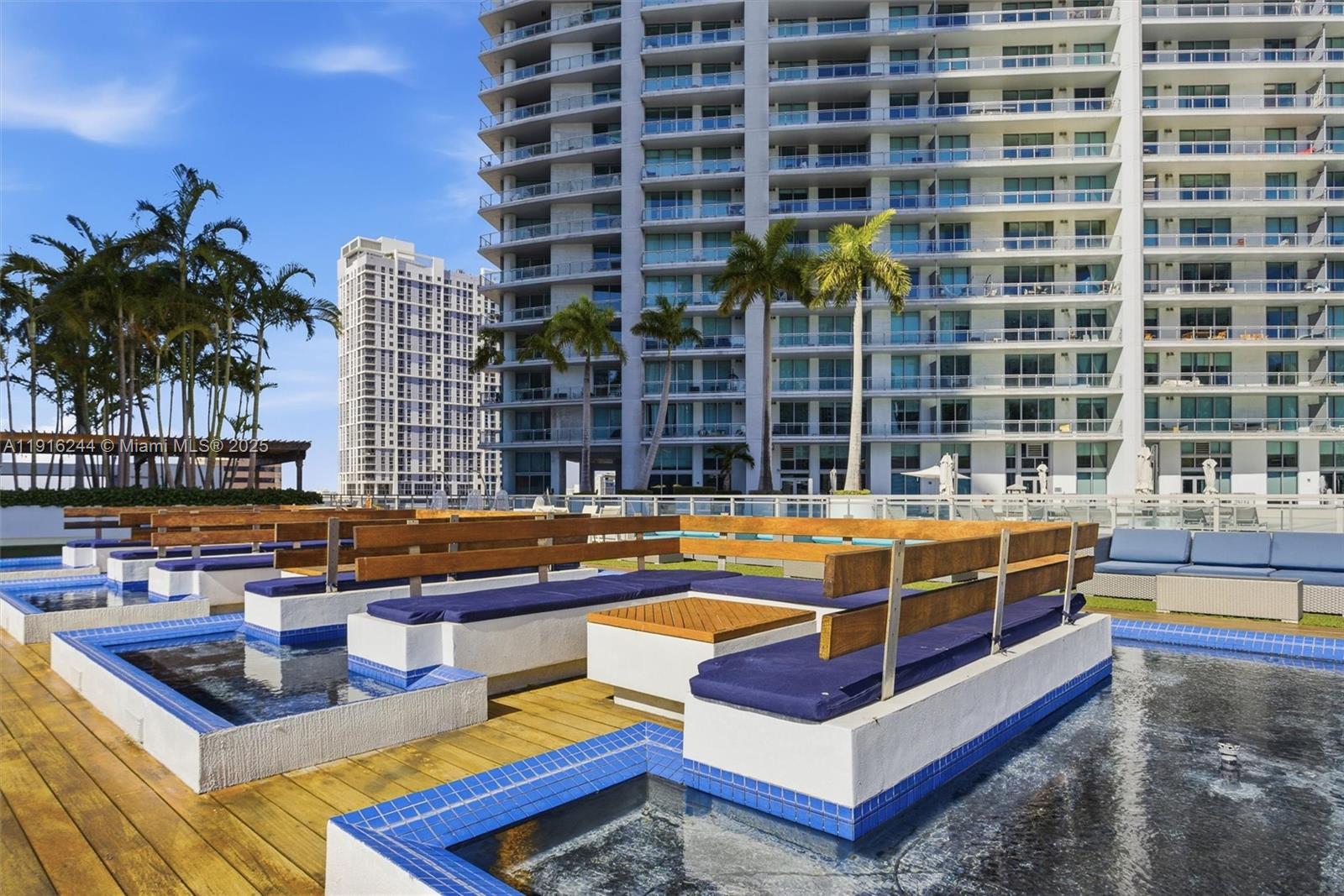 92 Southwest 3rd Street, Unit 1604 Miami, FL 33130 - Photo 35 of 53 a view of swimming pool with chairs